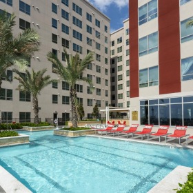 Resort-inspired pools with tropical landscaping a pool in a resort