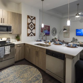 Open living concepts with easy connections a kitchen with wooden cabinets