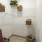 a white room with a white shelf and a white radiator