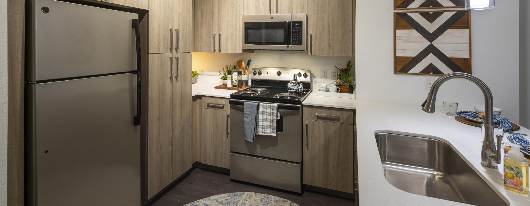 a kitchen with wooden cabinets